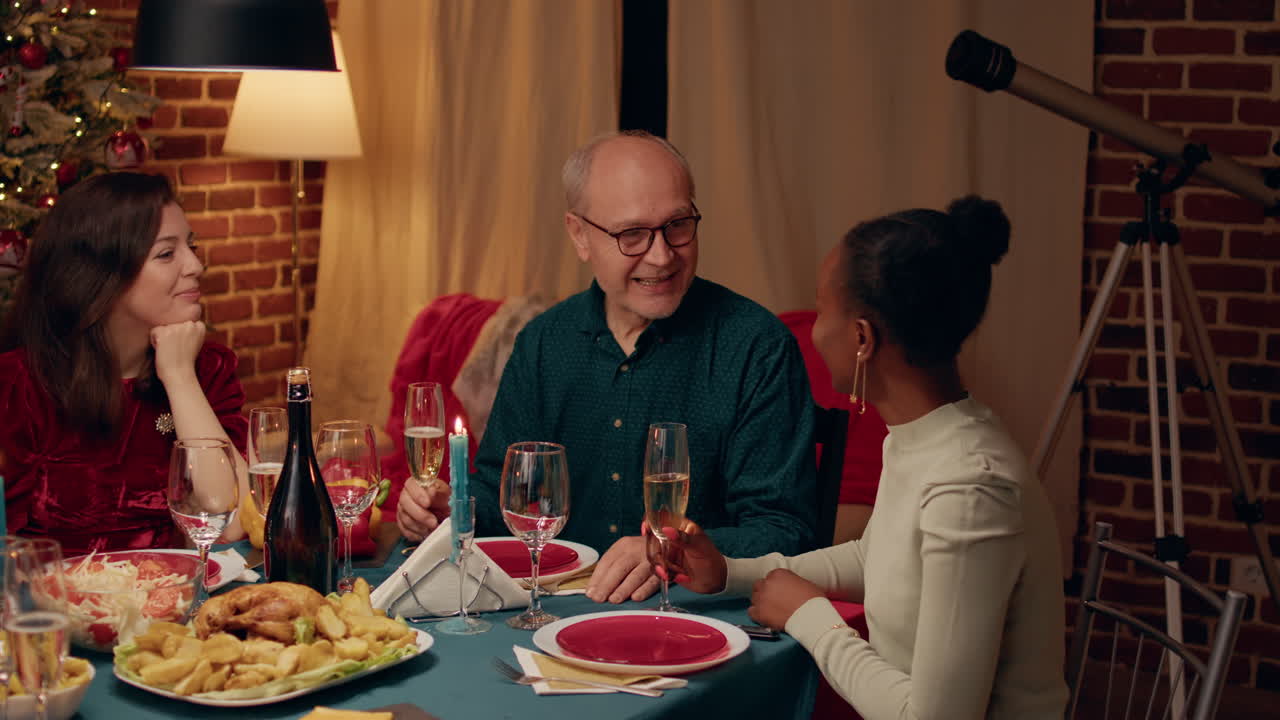 People toasting champagne at a festive dinner