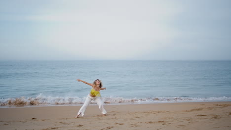 gorgeous woman dancing coast summer evening. young choreographer moving body