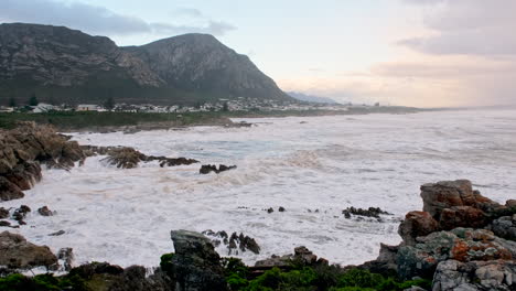 Turbulent-waves-crashing-into-rocky-shore-at-Voëlklip-Hermanus-in-winter-storm