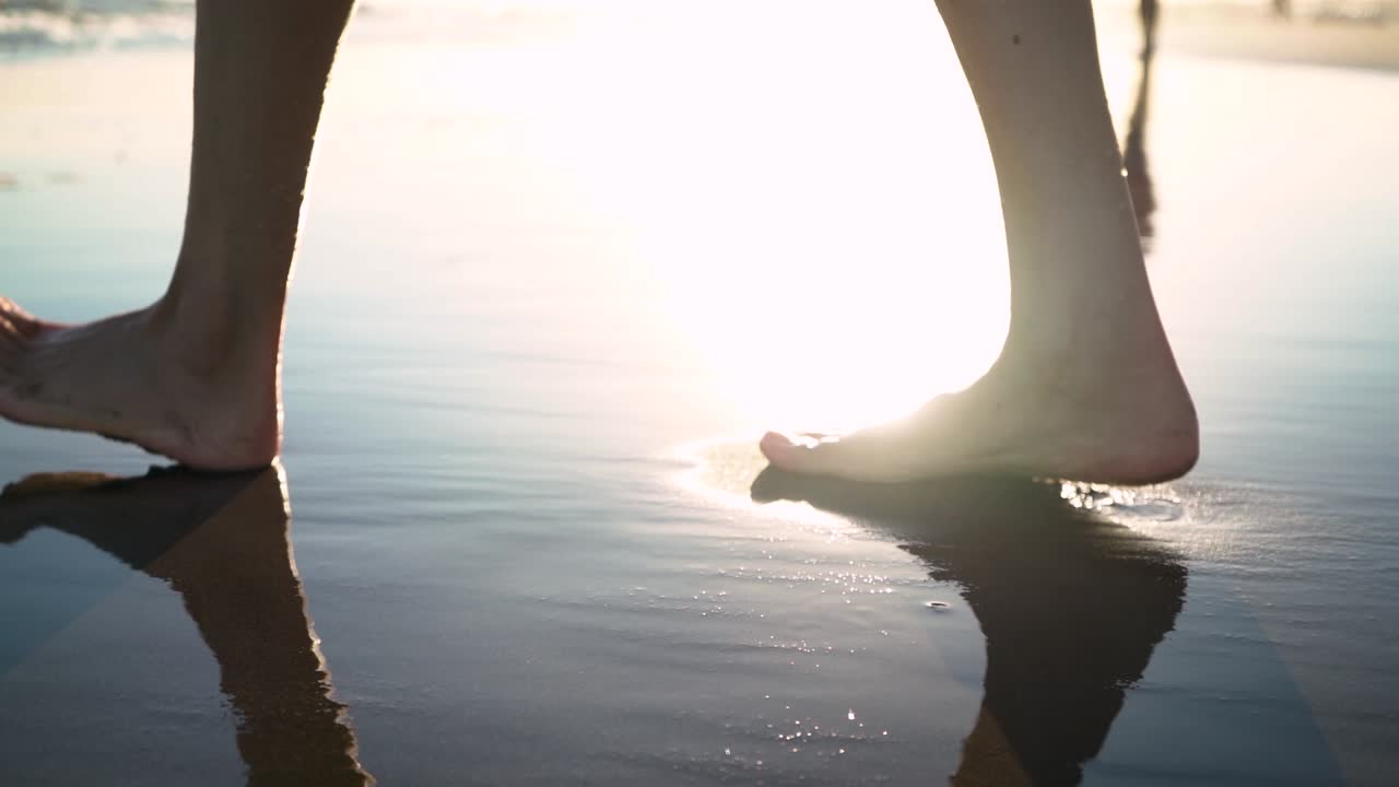 Barefoot Woman Walking On Wet Sand On Sunny Summer Beach - close up, slow motion