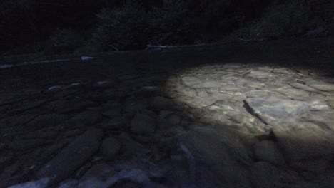 mysterious light on the night mountain river