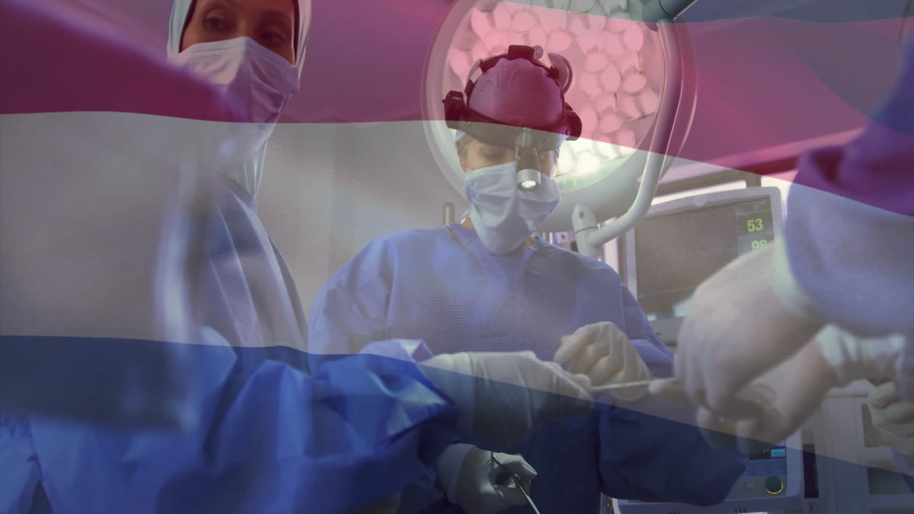 Lead surgeon inspecting forceps after assistant handing tool ensuring precise tissue grasping in OR