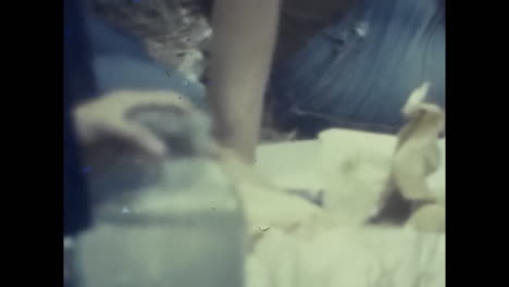 person holding a bottle of wine in soviet union. circa ussr 1980s: an archival video showing a person in the soviet union holding a bottle of wine.