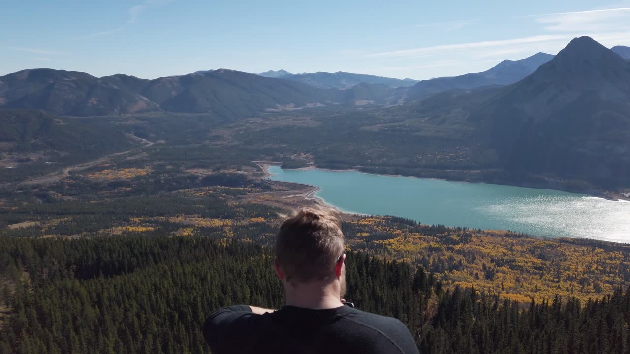 Hiker relaxing on peak at Barrier Lake Kananaskis Alberta static