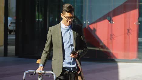 man using mobile phone while walking on street 4k