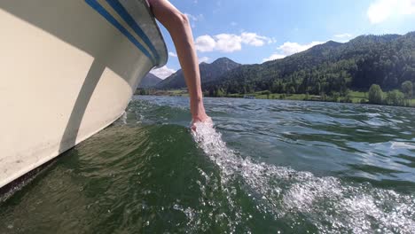 schliersee lake in bavaria munich this beautiful lake was recored using dji osmo action in 4k summer 2020 touching water from the boat