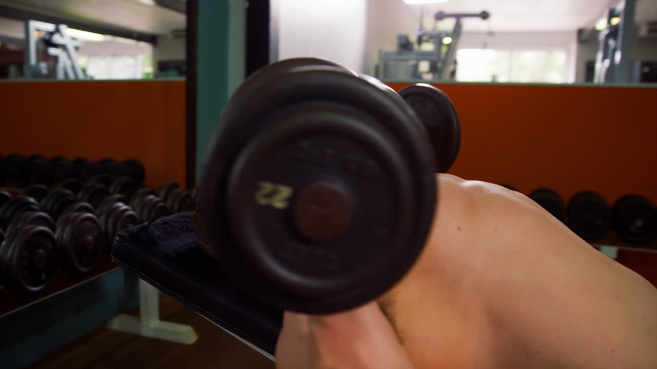 Man lifting heavy dumbbells