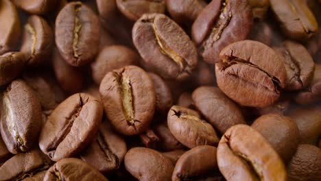 close up of seeds of coffee. fragrant coffee beans are roasted smoke comes from coffee beans.