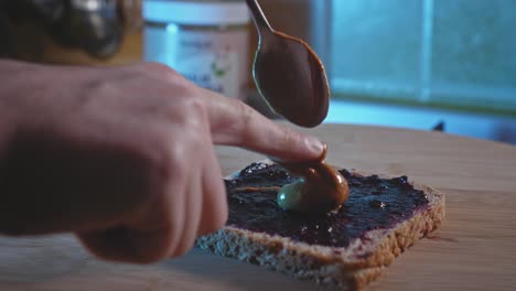 Prepping-Pre-workout-Snack-Peanut-Butter-And-Blueberry-Jelly-Sandwich-In-The-Kitchen