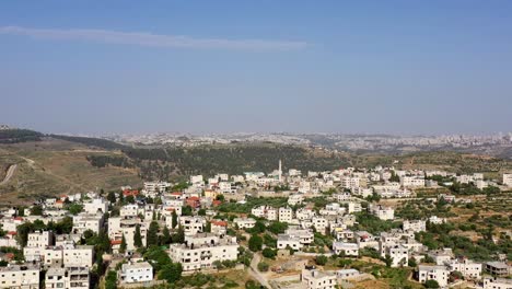 aerial view of a middle eastern village in hilly terrain