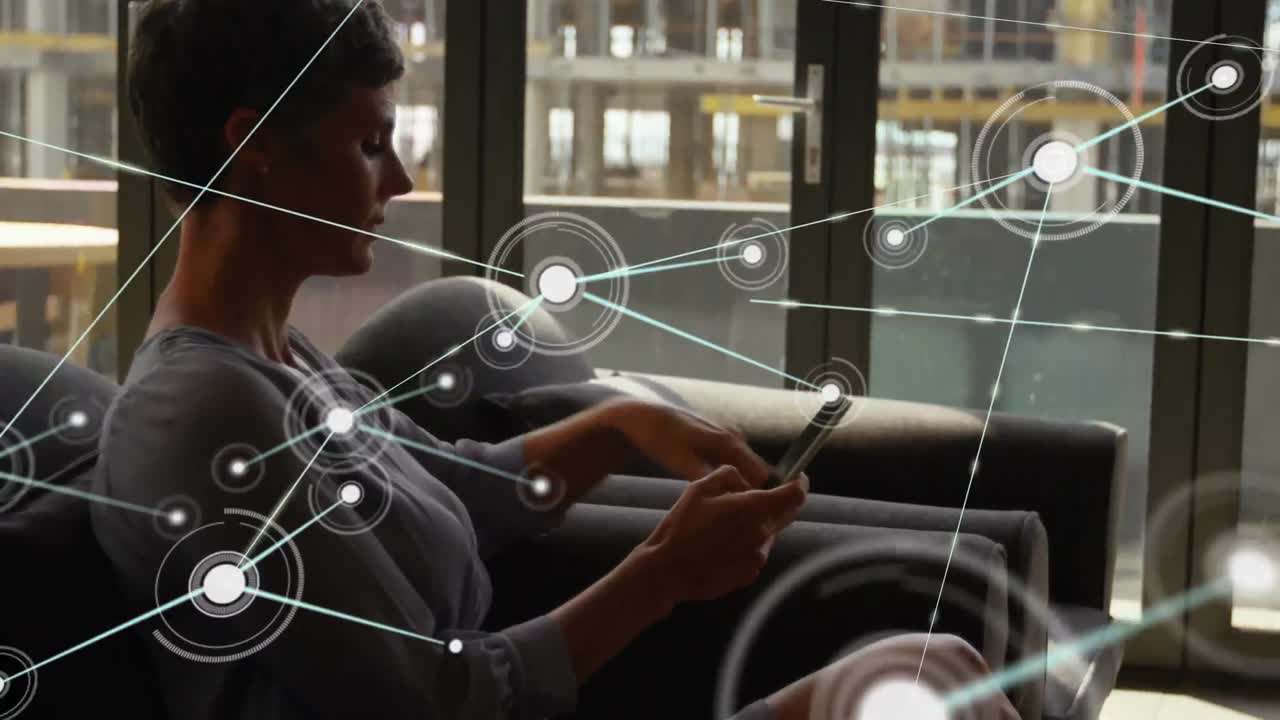 Animation of network of connections over caucasian businesswoman using smartphone