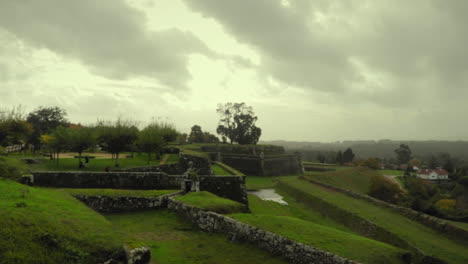 ancient castle fortress field grounds on a rainy day