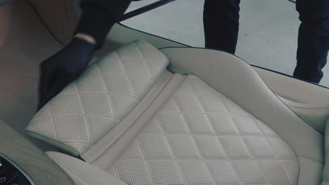 Cleaning-a-white-leather-chair-in-car