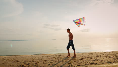 Teen-Playing-With-A-Kite-Near-The-Sea-In-The-Beautiful-Sky