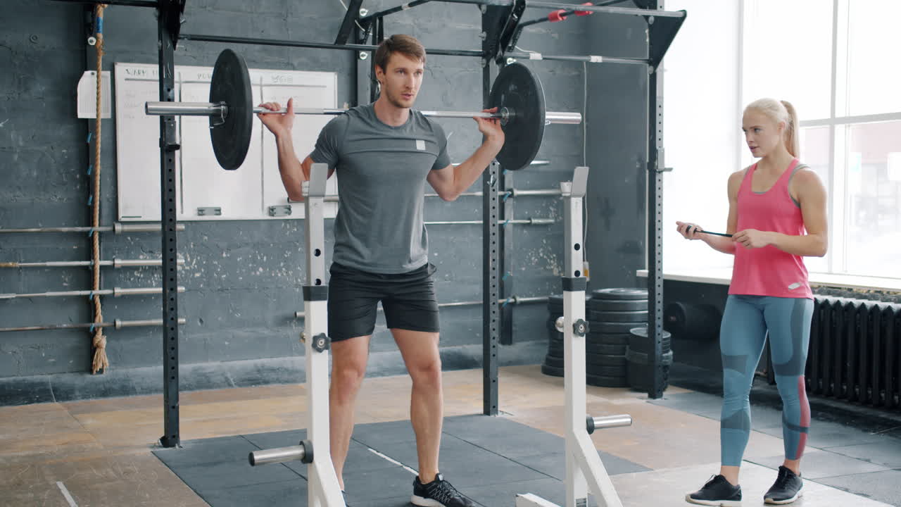 Man Weightlifting with Trainer