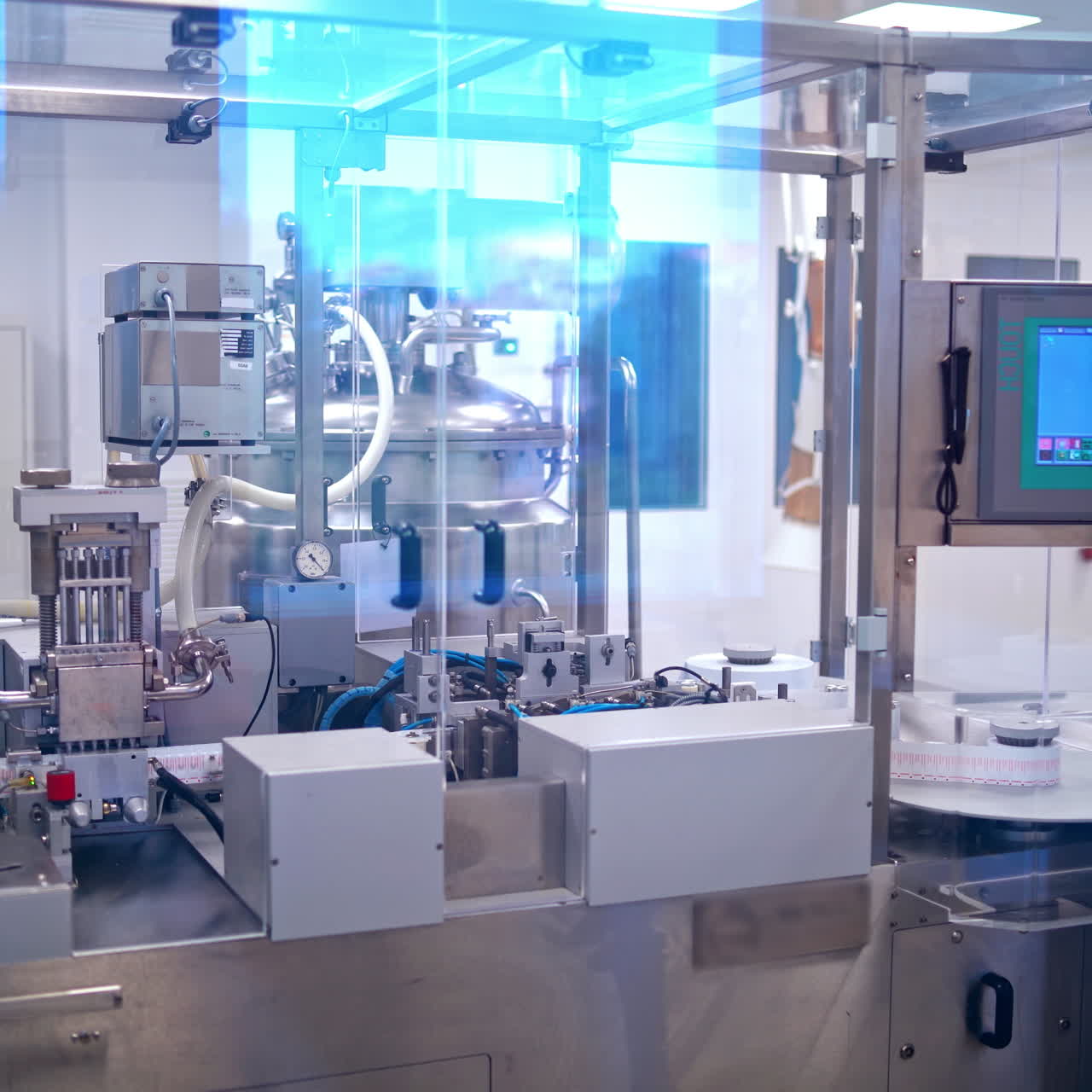 Pills production. Modern automated equipment inside the pharmaceutical plant. Pharmacy industry.