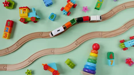 childish toy wooden railway. toy train travel along the railway. child's educational toys. top view. copy space