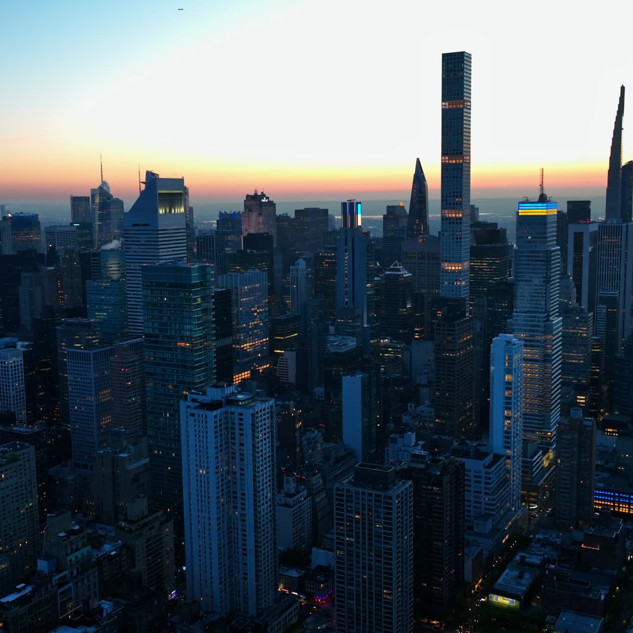 Fantastic skyscrapers light the fires in the evening. Beautiful sundown in New York city