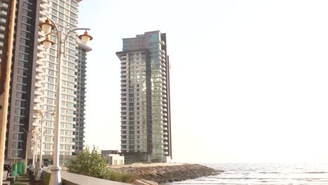 Karachi-,-Pakistan---:-Pear-And-Reef-Towers-Seen-Through-Morning-Mist-With-Traffic-Going-Past-In-Karachi