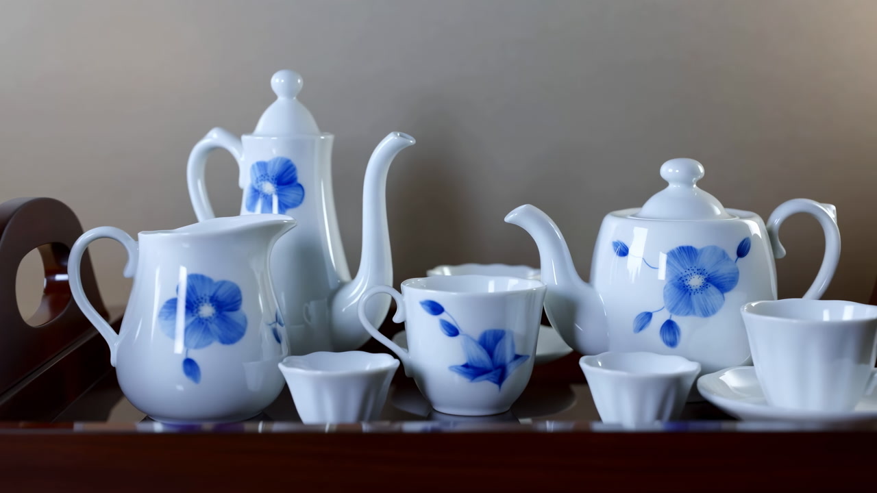 White Porcelain Tea Set On Tray With Blue Floral Motifs, Teapot, Creamer, Sugar Bowl, Cups And Saucers