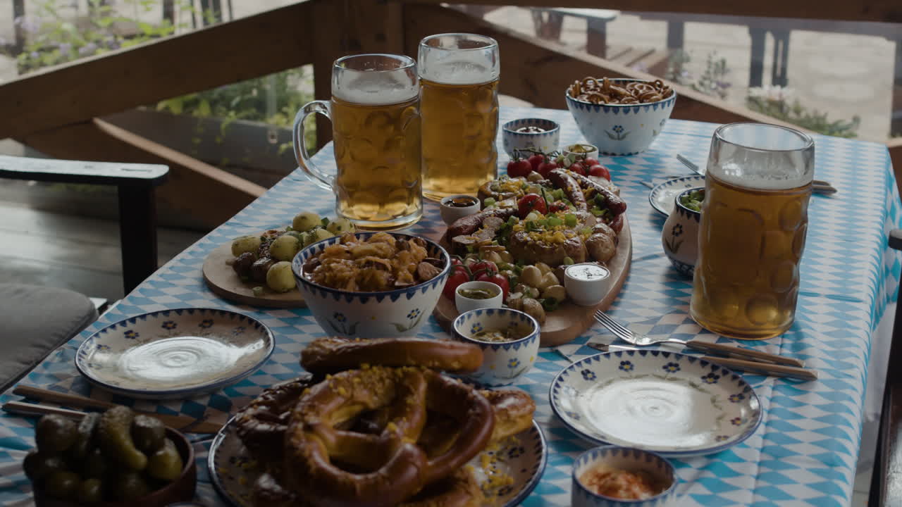 Oktoberfest feast with beer and pretzels on a wooden table
