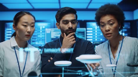team brainstorming in a tech control room