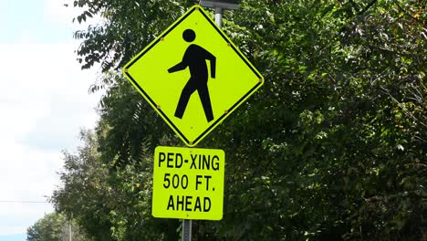 ped crossing sign with flashing warning lights