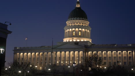 a panning shot of the the state of utah capitol building at salt lake city during the night with its lights on.