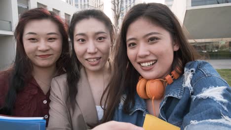 group of asian university students on video call. selfie view.