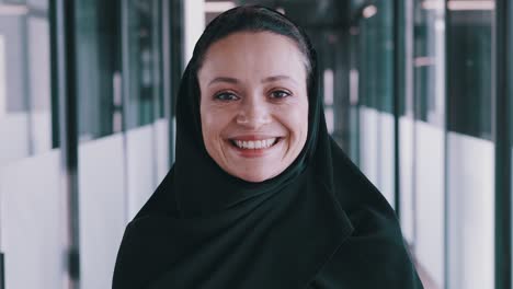 beautiful arabian woman with abaya dress working in the office