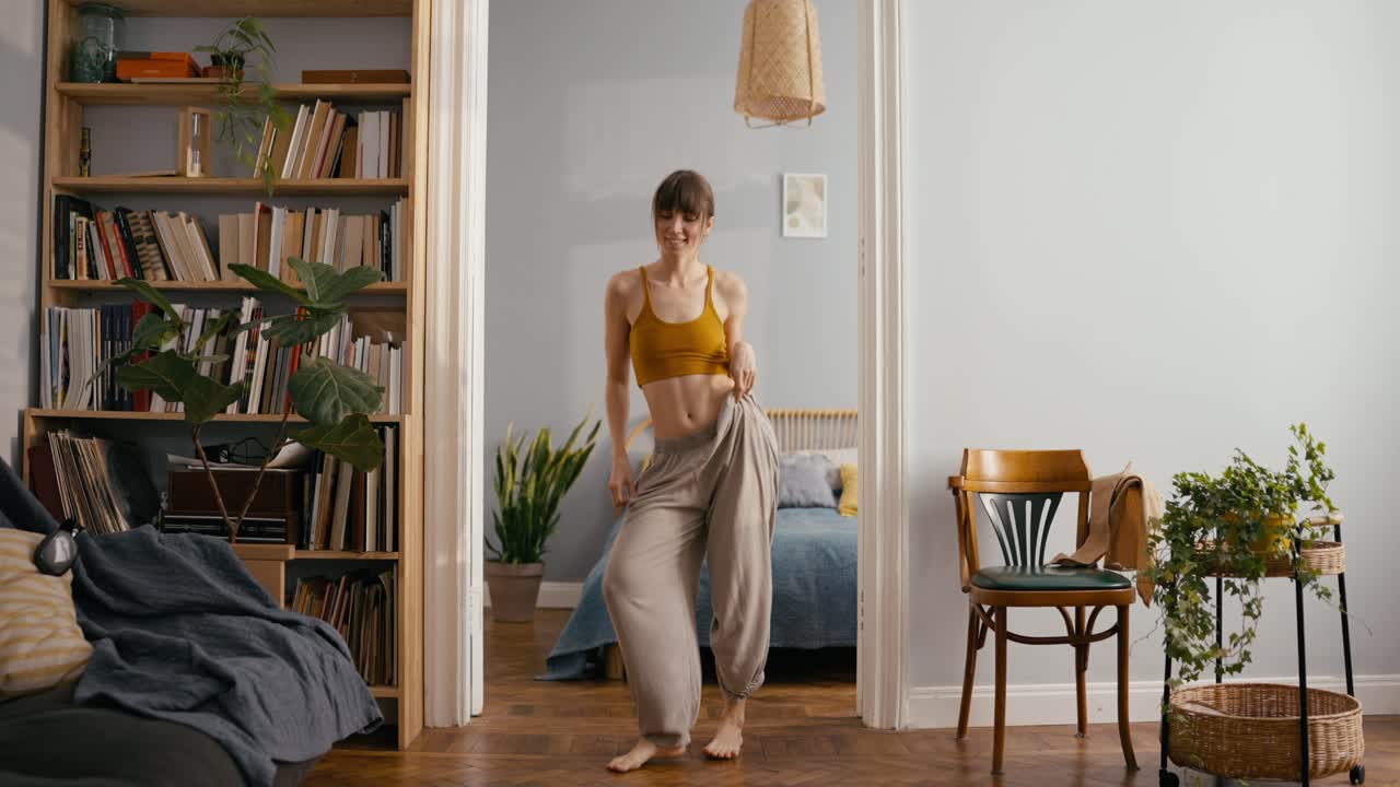 Woman dancing in her apartment