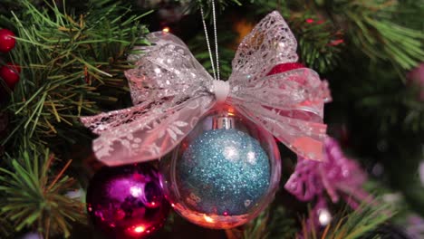 transparent christmas ball hanging from the christmas tree