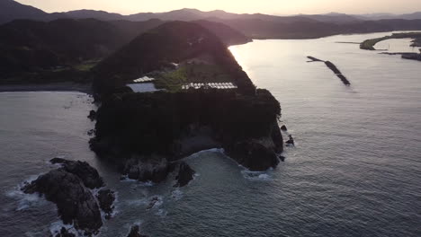 aerial view of a scenic coastal island at sunset
