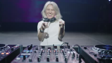 female dj performing at a nightclub