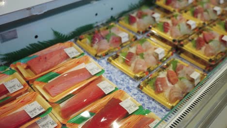 sashimi and sushi on sale in japanese market, freshly caught from seaside town