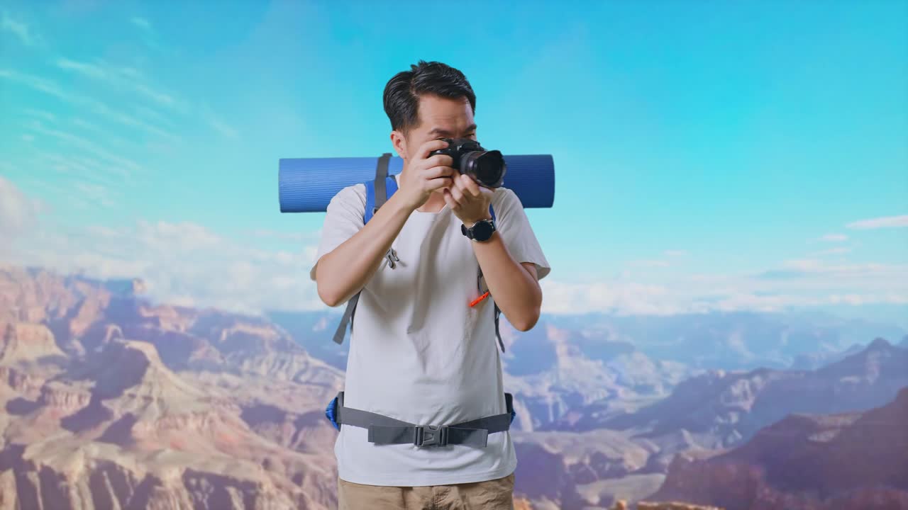 Asian Male Hiker With Mountaineering Backpack Using A Camera Taking Picture While Traveling At The Top Of Mountain