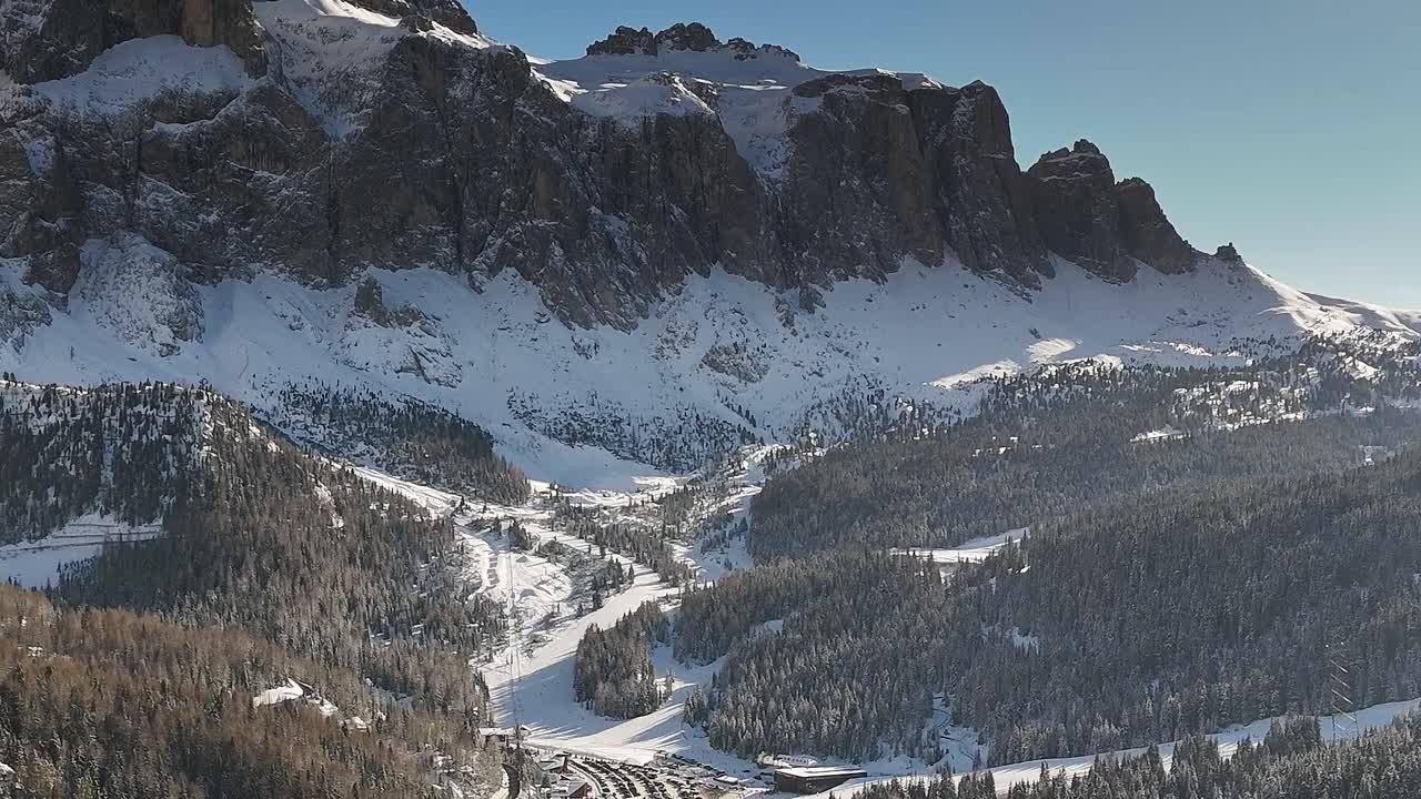 Snowy mountains of the Alps in Italy near a small village in winter
