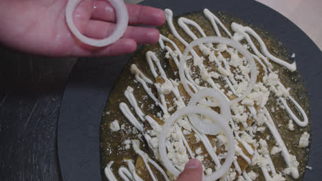 adding onion to a traditional mexican dish