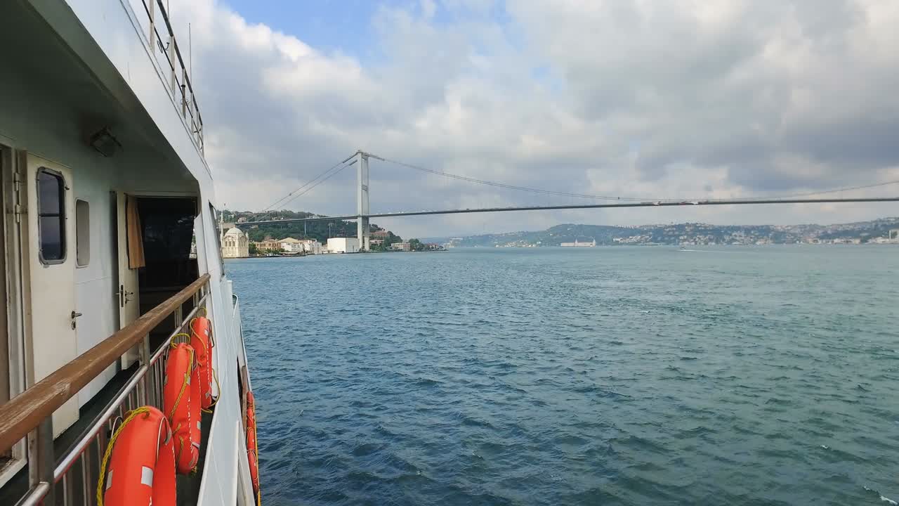 Pov from boat tourist tour cruise under, Bosporus bridge in Istanbul, Turkey