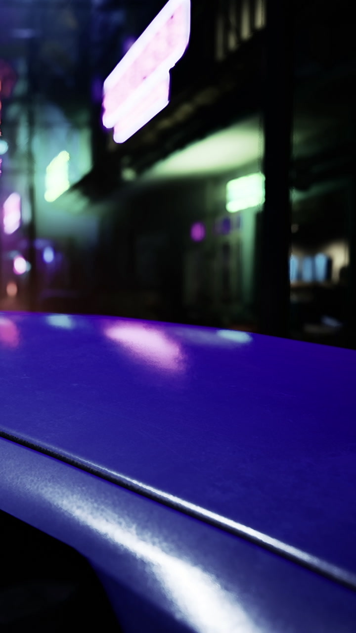Bright neon lights reflect on a glossy surface at night in an urban area