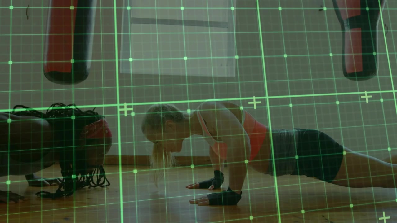 Male partner leading descent, both doing pushups for fitness with green grid overlay guiding form