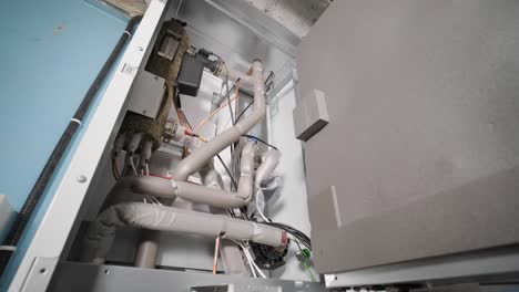 hvac technician installs heating, ventilation and air conditioning systems