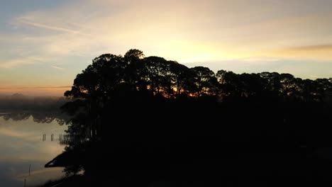 Early-morning-sunrise-and-fog-lifting-over-Powell-Lake