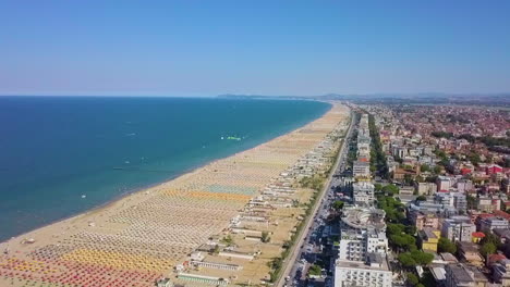 panoramic view of rimini beach and city in italy during summer season - aerial shot