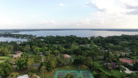 View-Over-a-Lakeside-Park-Revealing-Beautiful-Lake-in-the-Evening