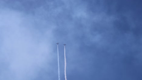 planes performing stunts and leaving smoke trails