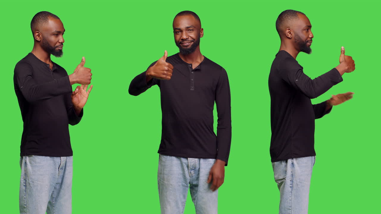 Man giving thumbs up on green screen