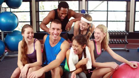 Fit-people-smiling-at-camera-in-gym