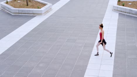 female ballet dancer performing on pavement 4k