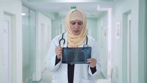 muslim doctor checking x ray report